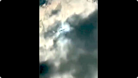 image An alien (dark) moves across the bright cloud